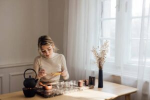 woman-making-cannabis-tea-following-recipe